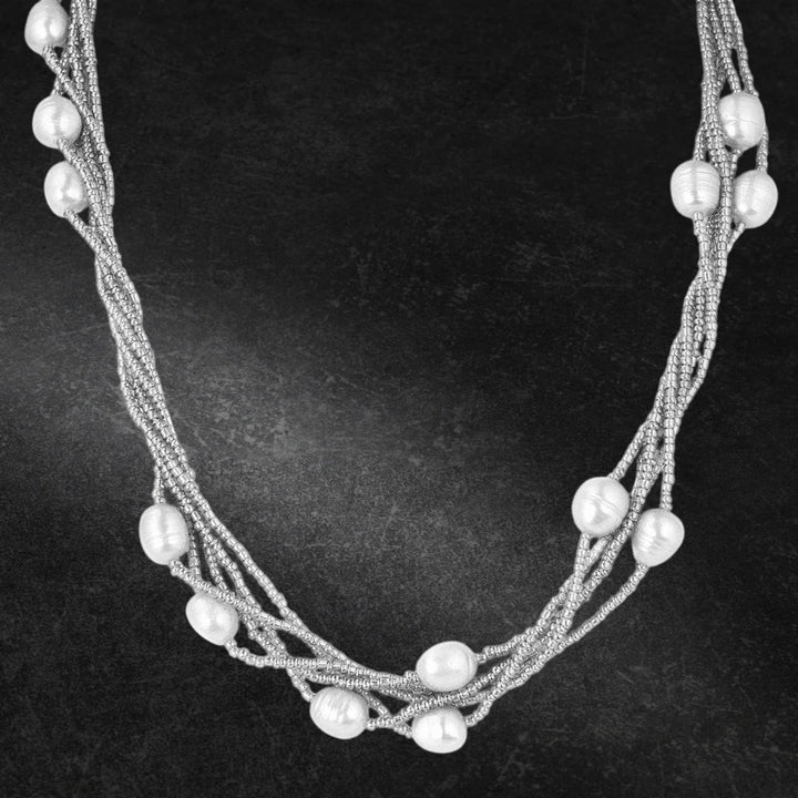 Dove Silver Pearl Necklace featuring multiple strands of delicate silver beads interspersed with lustrous pearls, designed for women’s elegant jewelry collections.