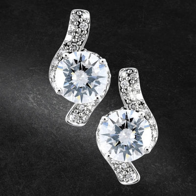 Sterling silver Sonata Earrings for female with a sparkling round central stone surrounded by smaller stones in a swirl design, elegant jewelry for special occasions.
