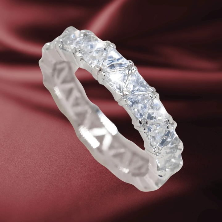 Triana Ring featuring a sterling silver band with rhodium plating, adorned with large square-cut clear stones, designed elegantly for women’s jewelry collections.