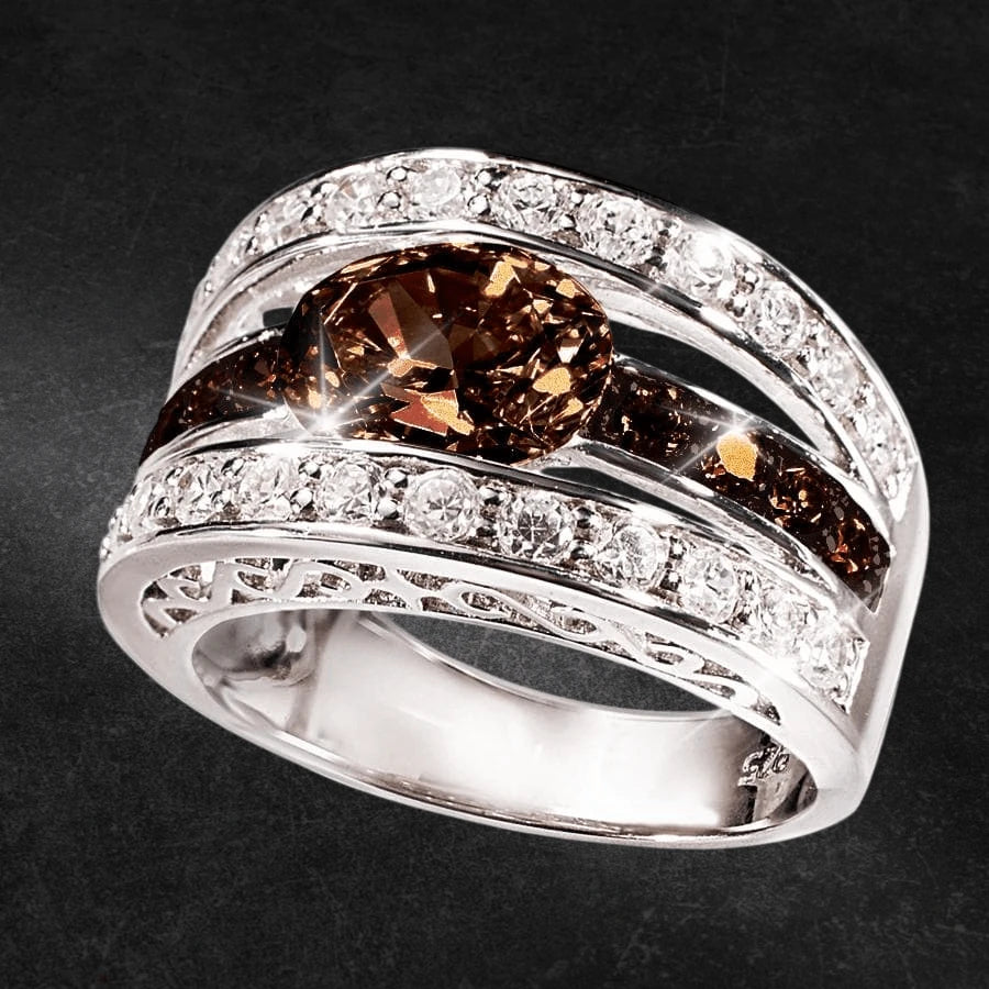 Verona Chocolate Ring featuring a sterling silver band with rhodium plating, adorned with a central chocolate-colored gemstone and sparkling clear stones, designed for women.