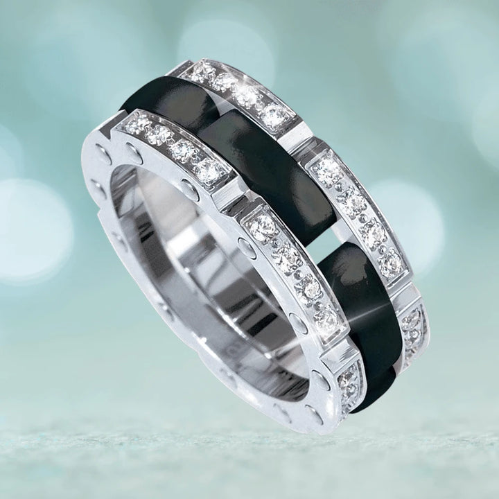 Ceramic Perfection Black Ring featuring a sleek black ceramic band accented with sparkling clear stones set in polished silver, designed for women seeking elegant jewelry.