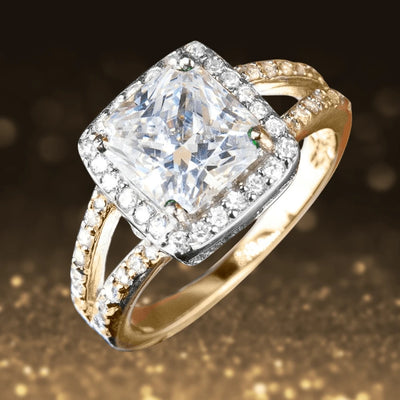 Madison Ring featuring a large square-cut center stone surrounded by smaller crystals, set in sterling silver with gold plating, designed for women’s elegant jewelry collections.