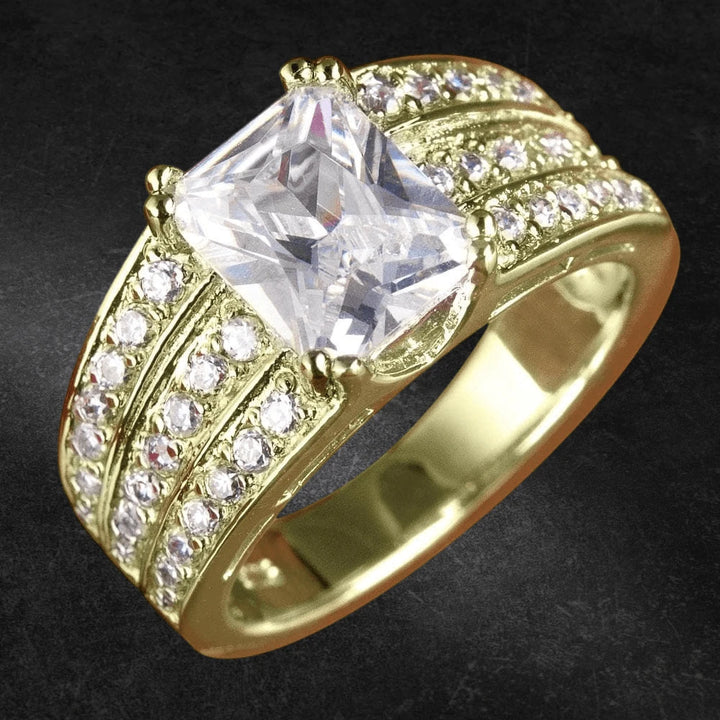 Princess Ring (Gold) featuring sterling silver material with gold plating, designed for females, showcasing a large rectangular clear gemstone and multiple smaller clear stones embedded in the band.