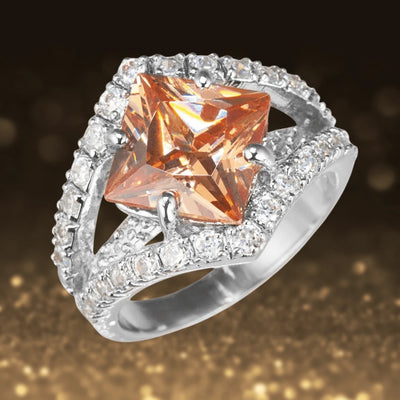 North Star Ring featuring a striking princess-cut orange gemstone set in sterling silver with sparkling pavé accents, designed elegantly for women’s jewelry collections.
