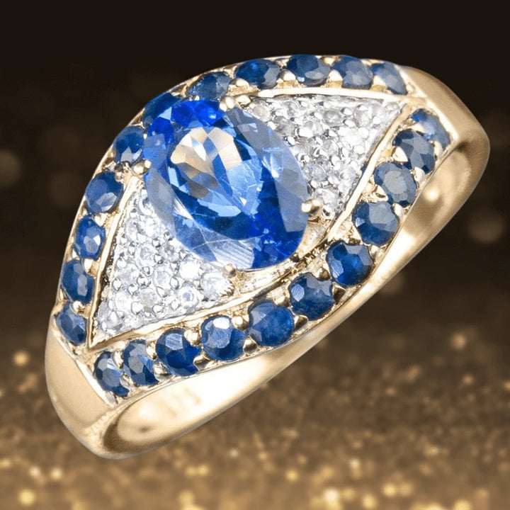 Nazar Ring featuring a pear-shaped blue gemstone surrounded by blue and clear stones in a gold-plated sterling silver setting, designed for women’s jewelry collections.