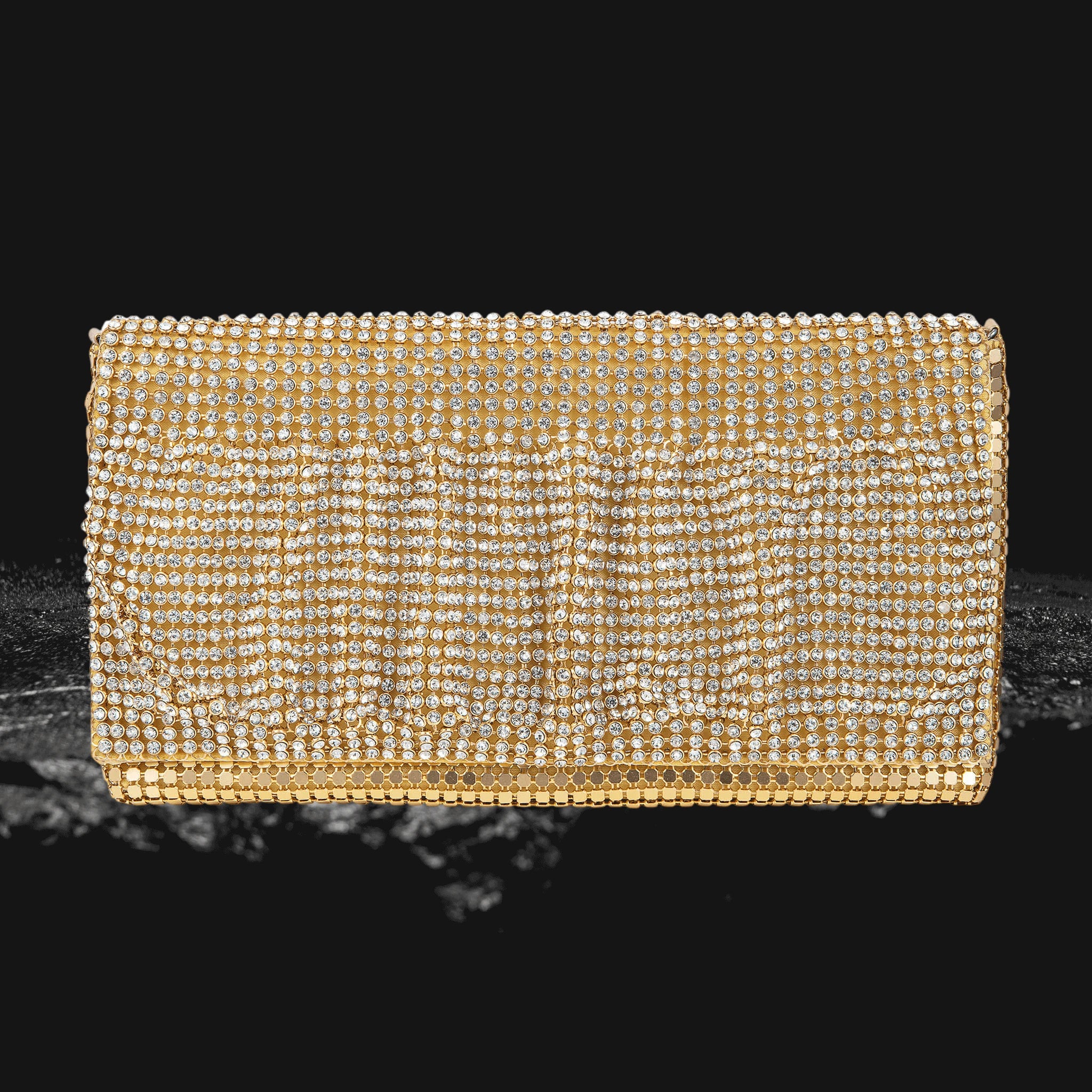 Gold Ruffle Clutchbag encrusted with shimmering crystals, designed for women seeking a glamorous and elegant accessory for evening wear or special occasions.