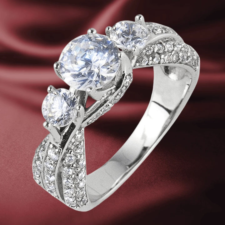 Climbing Rose Ring crafted in sterling silver with rhodium plating, featuring three sparkling stones set in an elegant, detailed band designed for women’s jewelry.