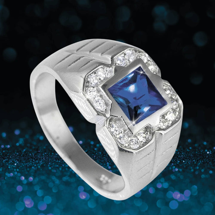 Ranger Men's Sapphire Ring featuring a sterling silver band with rhodium plating, centered with a square blue sapphire gemstone surrounded by sparkling clear stones for a bold jewelry statement.