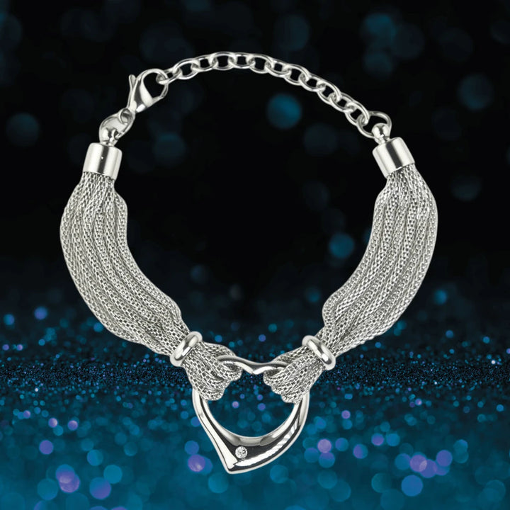 Steel Heart Bracelet for female, crafted from stainless steel with intricate woven chains and a heart-shaped pendant detailed with a small crystal, elegant jewelry bracelet.