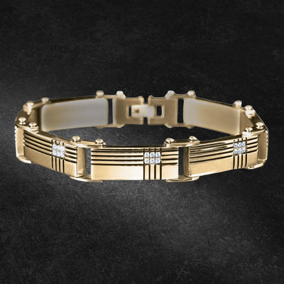 Deckmaster Gold Bracelet, a men's gold-plated stainless steel bracelet with a sleek, modern design featuring horizontal engraved lines and square diamond accents, perfect for stylish jewelry collections.