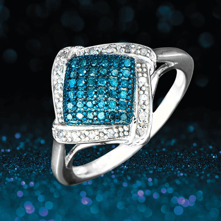 Diamonds & Denim Ring in sterling silver with two-tone plating, featuring a cluster of vibrant blue stones surrounded by clear diamonds, designed for women’s jewelry.
