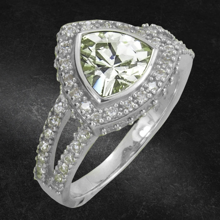 Trio Bay Ring featuring a sterling silver band with rhodium plating, adorned with a large triangular gemstone and intricate smaller stones for a dazzling jewelry statement.