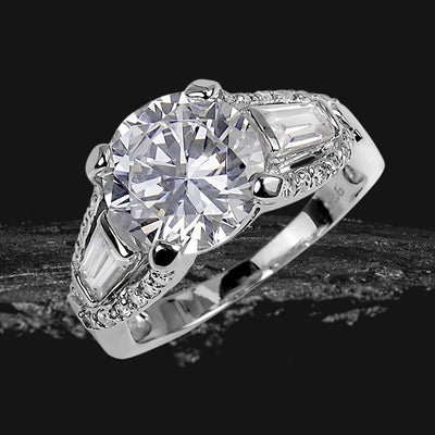 Tiara Ring crafted in sterling silver with rhodium plating, featuring a large round center stone and baguette side stones, designed for female jewelry collectors and enthusiasts.