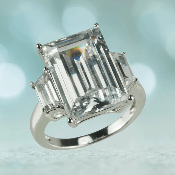 Casino Ring featuring a large emerald-cut clear gemstone set in sterling silver with rhodium plating, designed for female jewelry enthusiasts.