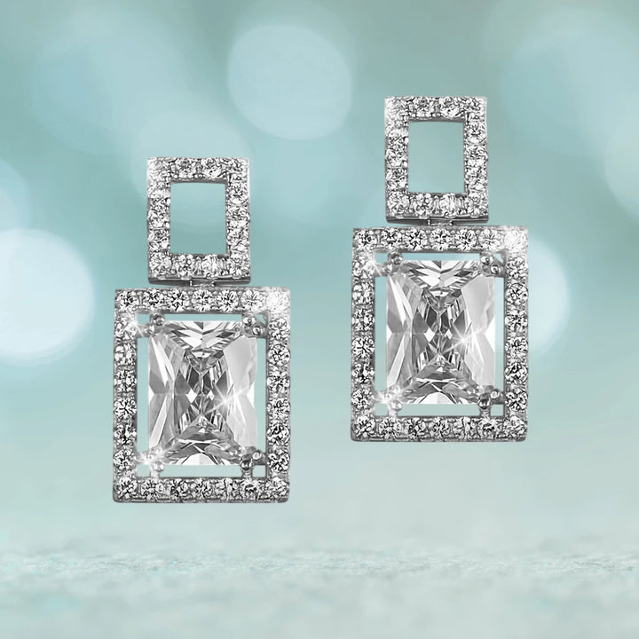 Imperial Peninsula Earrings featuring sterling silver design with rhodium plating, showcasing square-cut clear gemstones surrounded by smaller sparkling stones for elegant female jewelry.