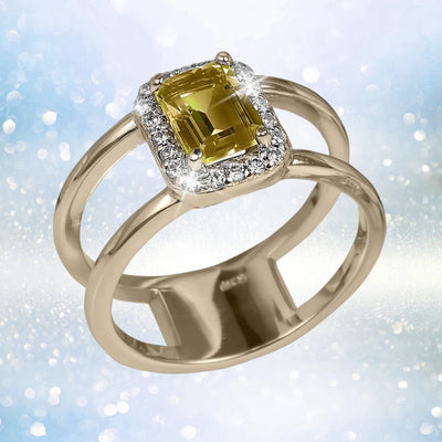 Destiny Citrine Ring featuring a gold-plated sterling silver band with a rectangular citrine gemstone surrounded by sparkling clear stones, designed for women’s jewelry.