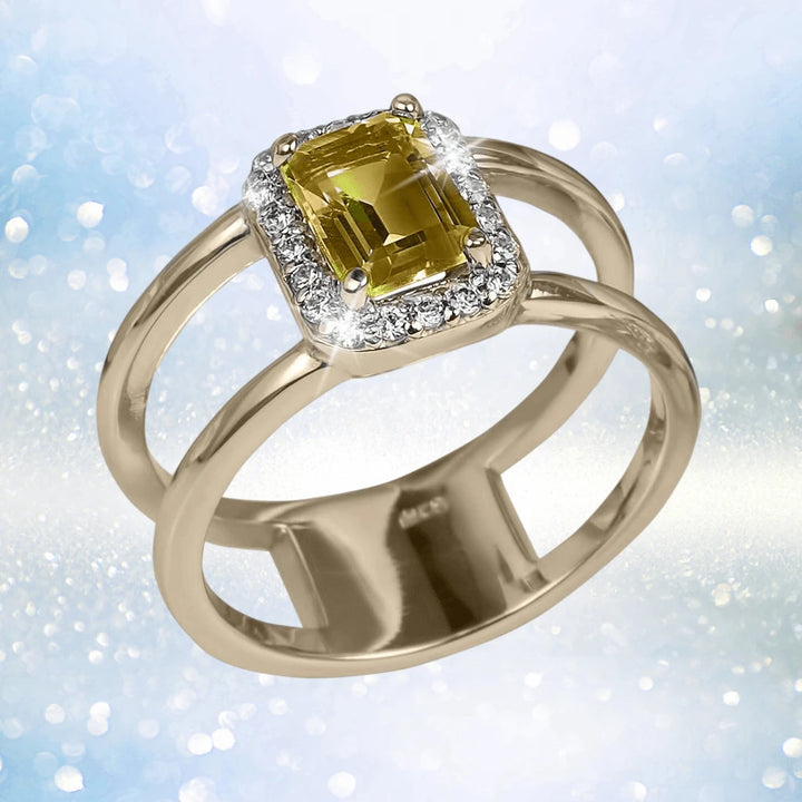 Destiny Citrine Ring featuring a gold-plated sterling silver band with a rectangular citrine gemstone surrounded by sparkling clear stones, designed for women’s jewelry.