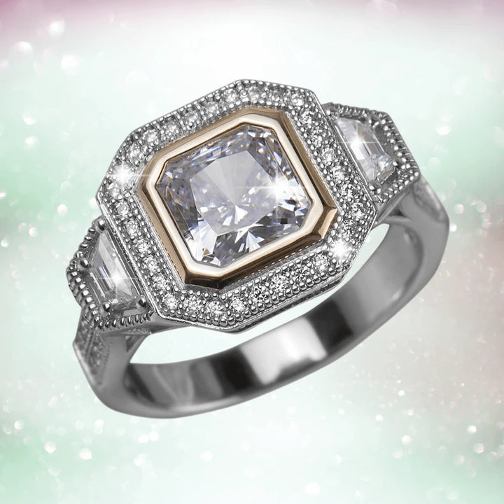 Dakota Ring featuring a two-tone sterling silver band with a central square-cut gemstone surrounded by smaller sparkling stones, designed for women’s jewelry collections.