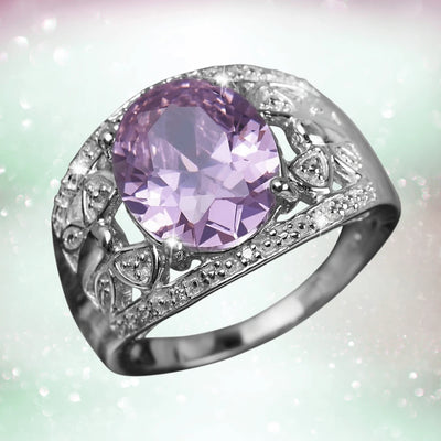 Rosette Ladies Ring featuring a large oval lavender gemstone set in sterling silver with rhodium plating, adorned with intricate decorative detailing for a refined feminine look.