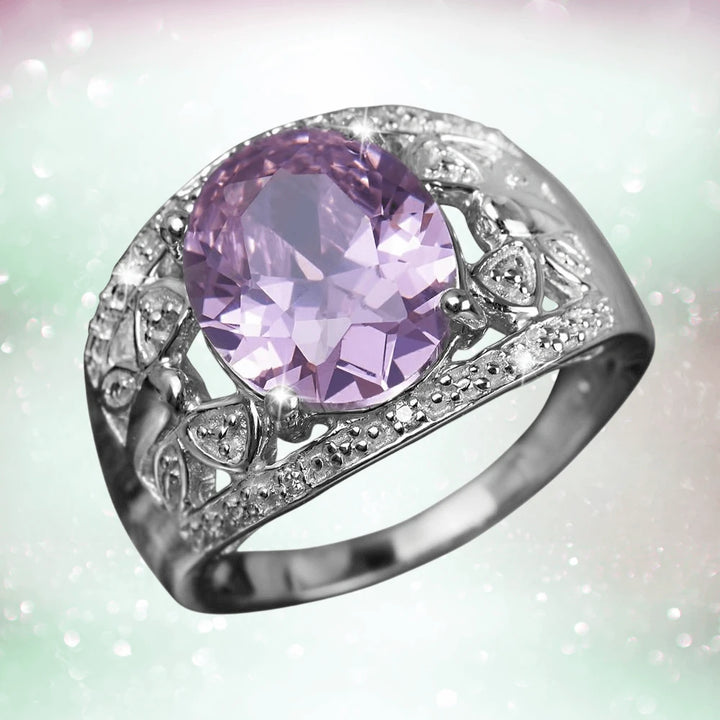 Rosette Ladies Ring featuring a large oval lavender gemstone set in sterling silver with rhodium plating, adorned with intricate decorative detailing for a refined feminine look.