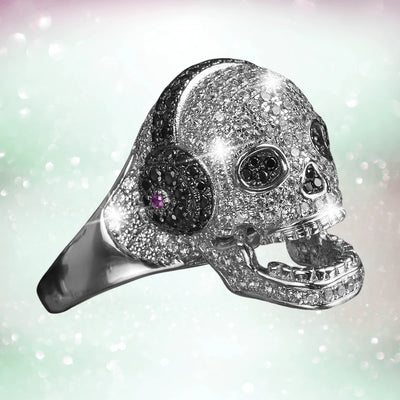 Sterling silver DJ Skull ring for female with rhodium plating, featuring a sparkling skull design accented with black and purple stones, perfect collectible jewelry.