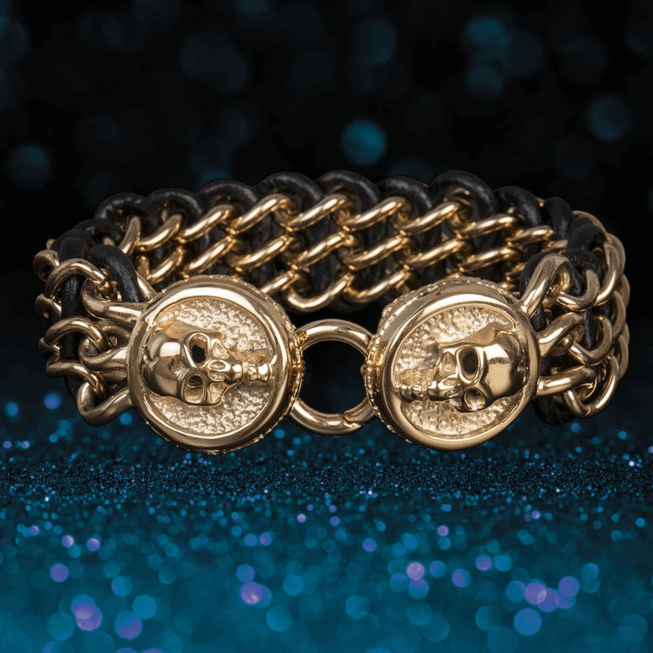 Men's Leather Yellow Gold Skull Bracelet featuring gold plated stainless steel skull accents intertwined with black leather, offering a bold statement jewelry piece for men.