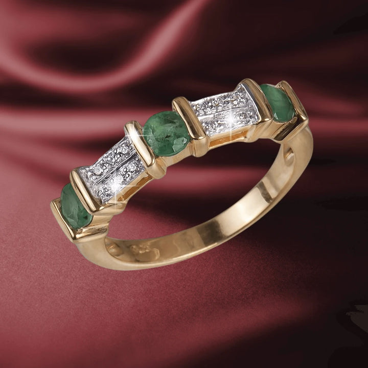 Trieste Emerald Gem Ring featuring sterling silver with gold plating, adorned with vibrant green emerald stones and sparkling clear accents, designed for women.