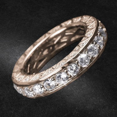 Close-up of a Portofino Rose Gold Ring featuring sterling silver construction with rose gold plating and a row of sparkling gemstones set around the band, designed for females.
