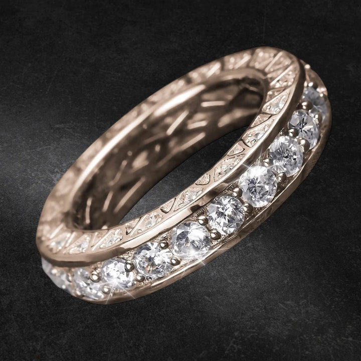 Close-up of a Portofino Rose Gold Ring featuring sterling silver construction with rose gold plating and a row of sparkling gemstones set around the band, designed for females.