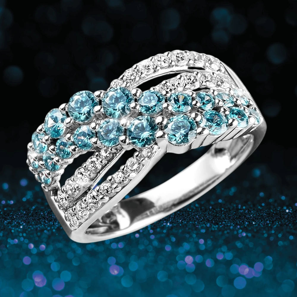 Aqua Cascade Ring featuring sterling silver with rhodium plating, adorned with sparkling blue and clear gemstones for an elegant female jewelry piece.
