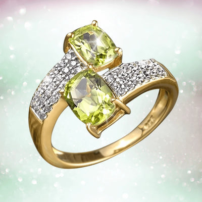 Peridot Hug Ring featuring two cushion-cut peridot stones set in sterling silver with gold plating, accented by sparkling clear stones, designed for women’s jewelry.