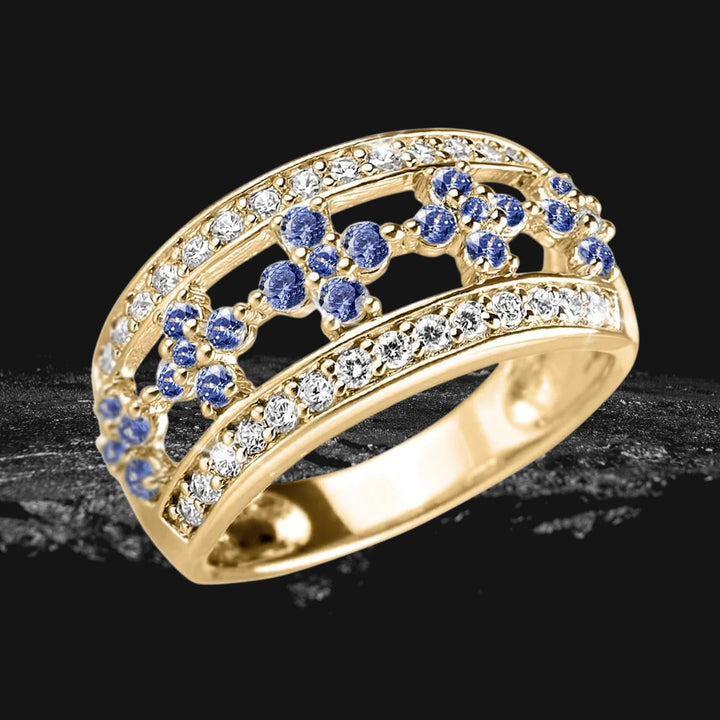 Ladies Gina Ring in sterling silver with gold plating, featuring rows of clear and blue gemstones, designed for elegant female jewelry collections.