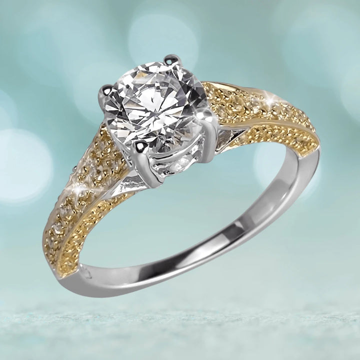 Davina Ring featuring a two-tone sterling silver band with gold plating and a large round clear gemstone centerpiece, designed for women’s jewelry collection.