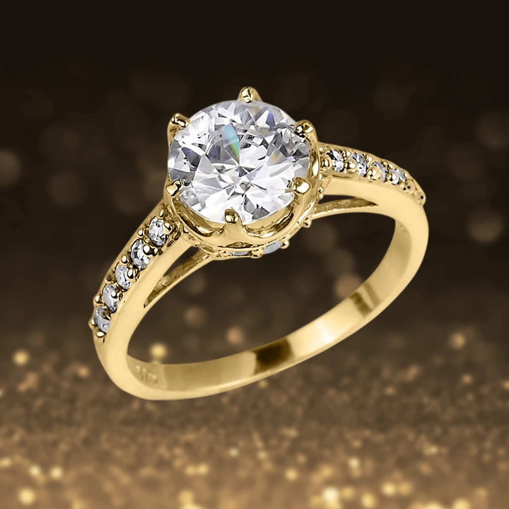Gold Crown Ring crafted from sterling silver with gold plating, featuring a solitaire round-cut clear gemstone and a band adorned with smaller sparkling stones, designed for women.