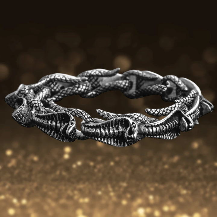 Venom Men's Steel Bracelet featuring intricately designed stainless steel linked serpent heads, creating a bold and stylish jewelry piece for men.