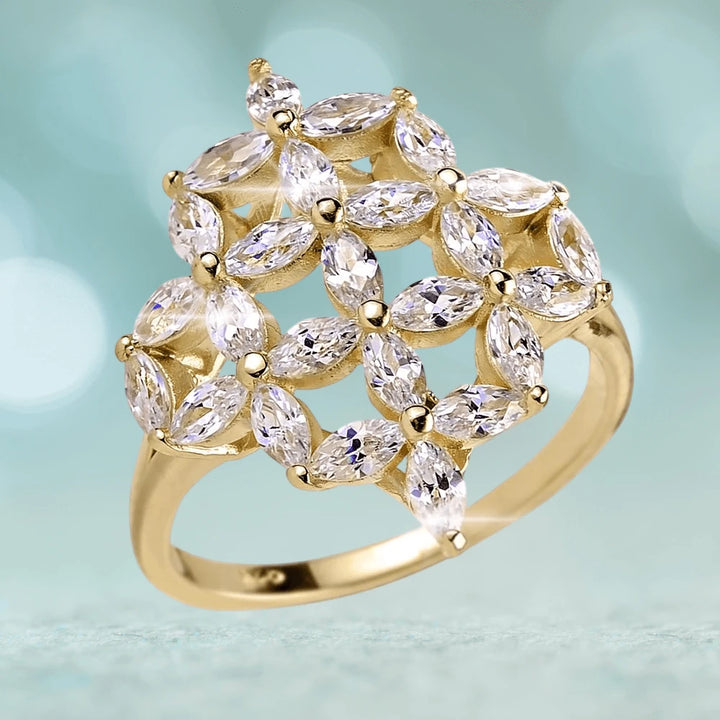 Floretta Gold Ring featuring a sterling silver base with gold plating, adorned with marquise-cut clear gemstones elegantly arranged in a floral pattern.