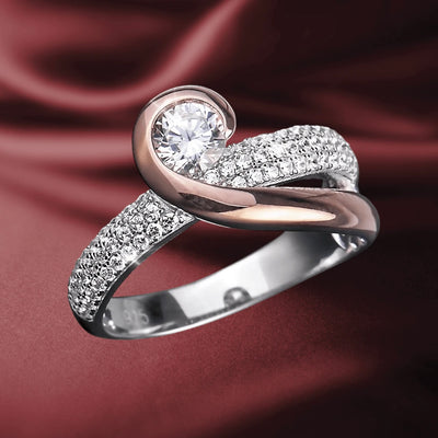 Emelia Ring featuring a two-tone sterling silver design with a sparkling round center stone and pavé-set accent diamonds on a graceful, intertwined band for women.