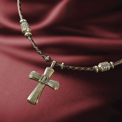 Midnight Skull Gold Fused Pendant featuring a gold-plated sterling silver cross design on a braided brown leather necklace, crafted for men’s jewelry collections.