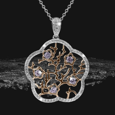 Imperial Cherry Blossom Pendant featuring two-tone sterling silver with delicate branches and sparkling gemstones, designed for a captivating feminine jewelry statement.