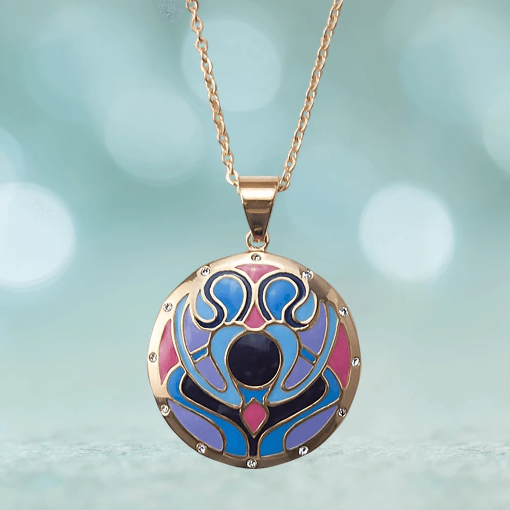 Golden Peacock Pendant featuring stainless steel construction with a colorful peacock-inspired design in blue, purple, and pink hues on a delicate chain necklace for women.