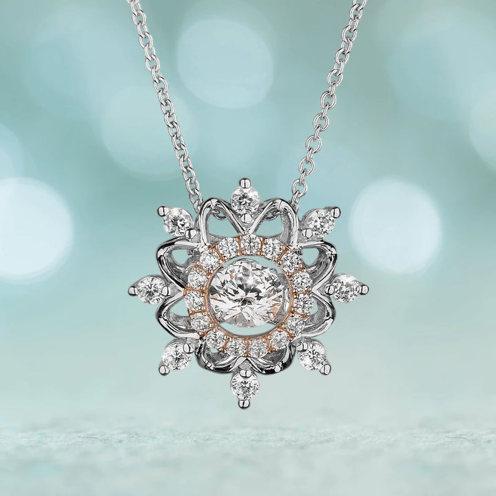 Dancing Snowflake Pendant featuring a two-tone sterling silver design with intricate crystal accents, elegantly crafted for women’s jewelry collections.