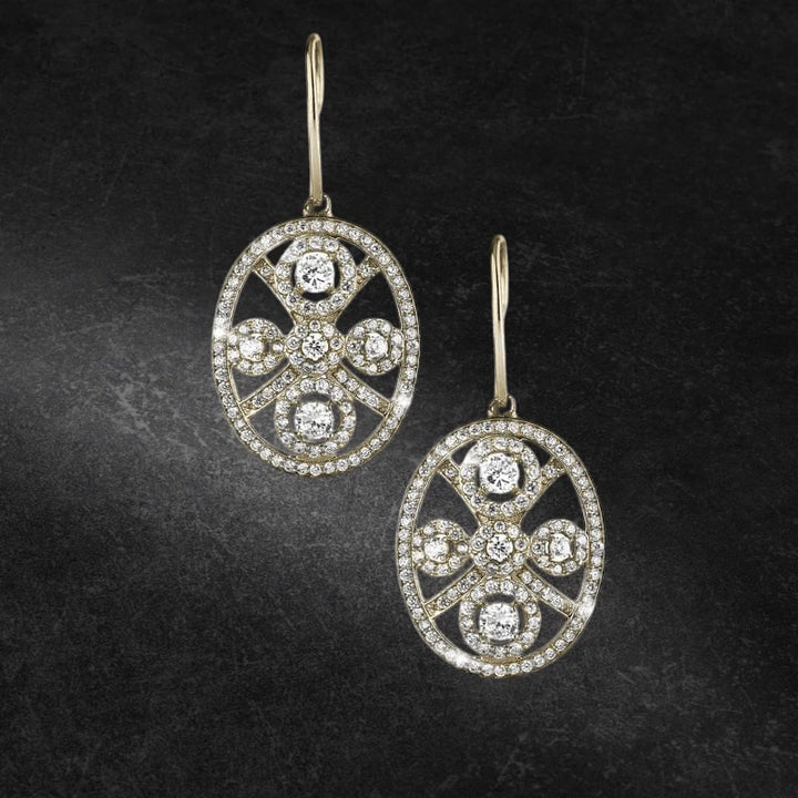Decora Ladies' Earrings crafted from sterling silver with gold plating featuring intricate oval design embellished with sparkling clear gemstones, elegant jewelry for women.