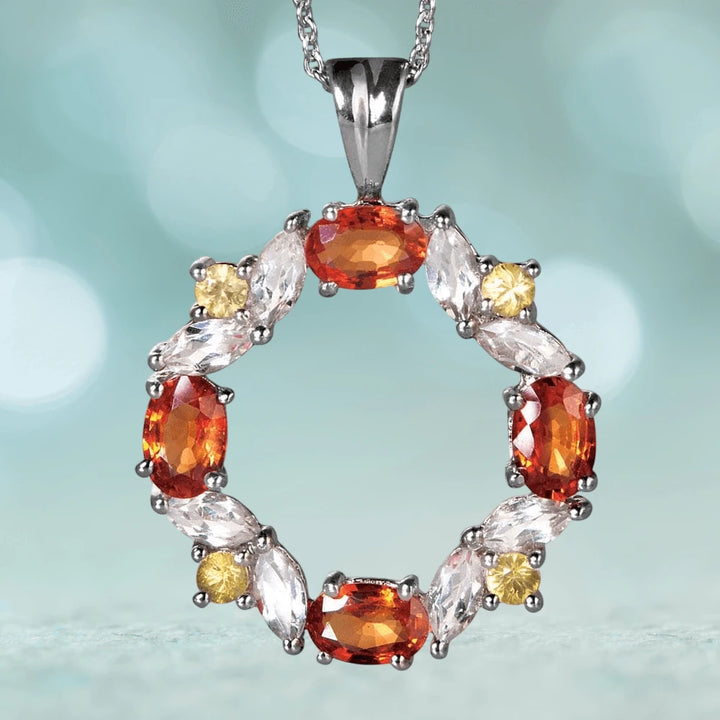 Champagne Sapphire Pendant featuring sterling silver with rhodium plating, adorned with vibrant orange, clear, and yellow gemstones in an elegant circular design for women’s jewelry.
