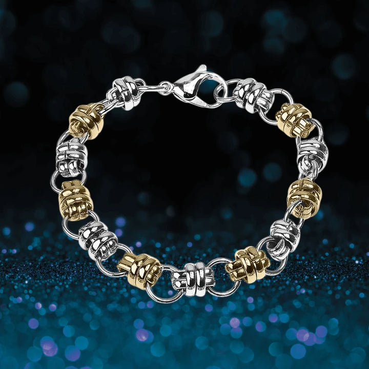 Quintus Steel Bracelet for male featuring alternating silver and gold-toned steel links with a secure lobster clasp, designed as a stylish men’s jewelry accessory.
