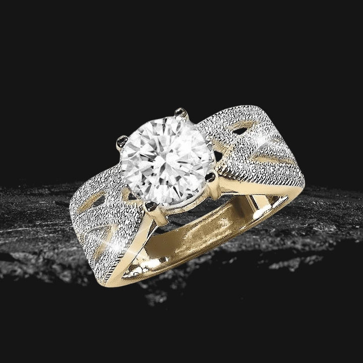Casini Cento Ring featuring a large round clear gemstone set in a detailed gold band with intricate textured silver accents designed for female jewelry enthusiasts.