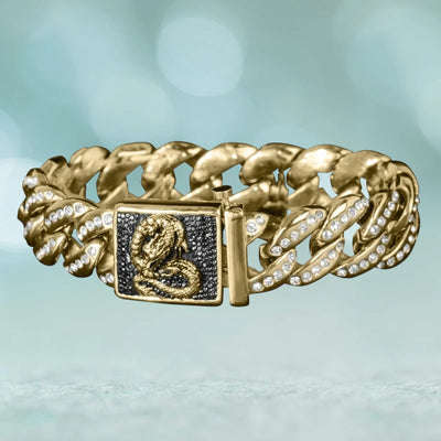 Dragon King Bracelet made of stainless steel with gold-tone finish featuring a bold chain design accented with sparkling stones and a detailed dragon emblem on the clasp.