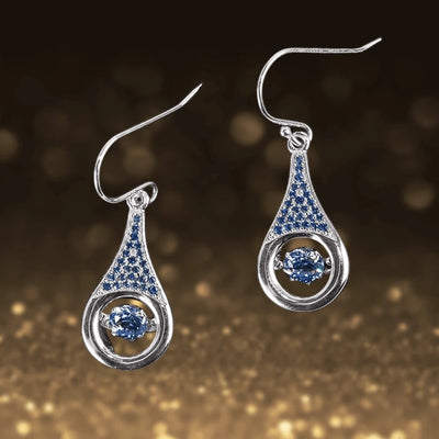 Indigo Dancing Earrings featuring sterling silver with rhodium plating, showcasing a teardrop design with indigo stones that capture light beautifully for a sophisticated female jewelry piece.