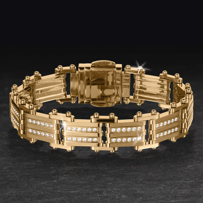 Modex Bracelet in polished gold tone metal with crystal accented panels and secure fold over clasp displayed on a dark surface Up To 75% Off Retail