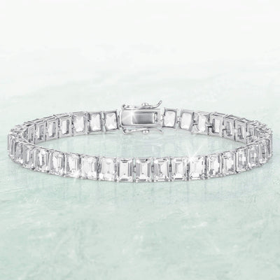 Fifth Avenue Emerald-Cut Bracelet with a silver-tone link band and rectangular clear stones displayed against a pale aqua background Up To 75% Off Retail