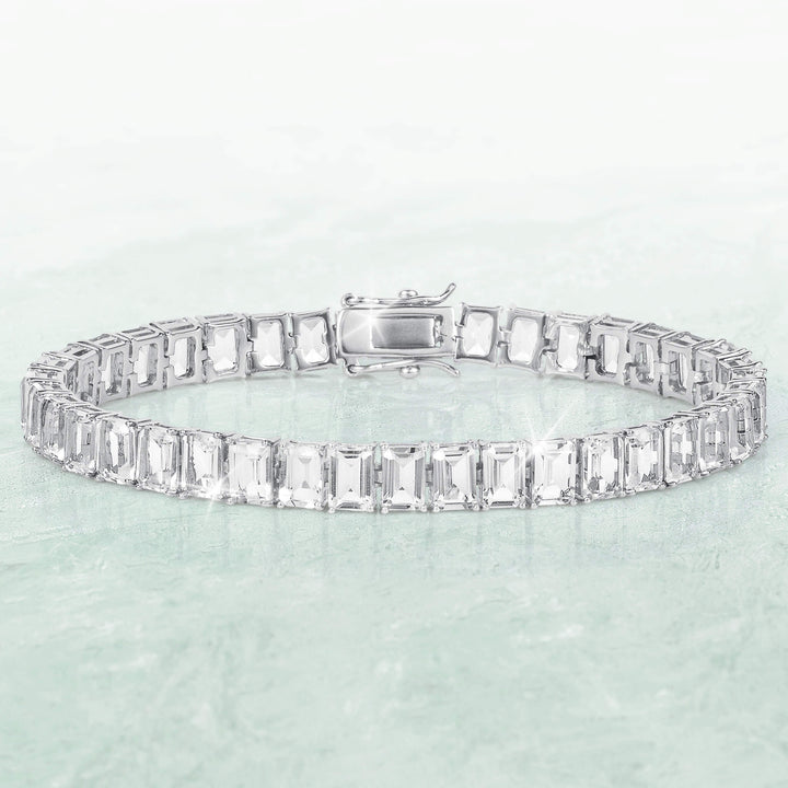 Fifth Avenue Emerald-Cut Bracelet with a silver-tone link band and rectangular clear stones displayed against a pale aqua background Up To 75% Off Retail